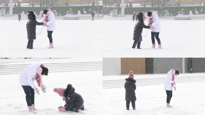 母女在雪地里玩耍 打雪仗冬季雪天