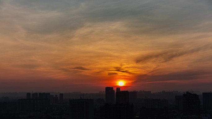 城市剪影日出红日朝阳朝霞霞光城市天亮延时