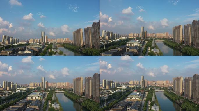 蓝天白云下的济南小清河高楼大厦城市风光