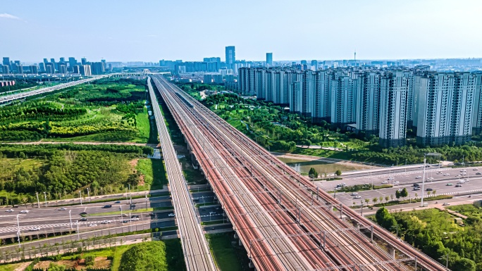 航拍延时高铁驶过城市和谐号复兴号高速铁路