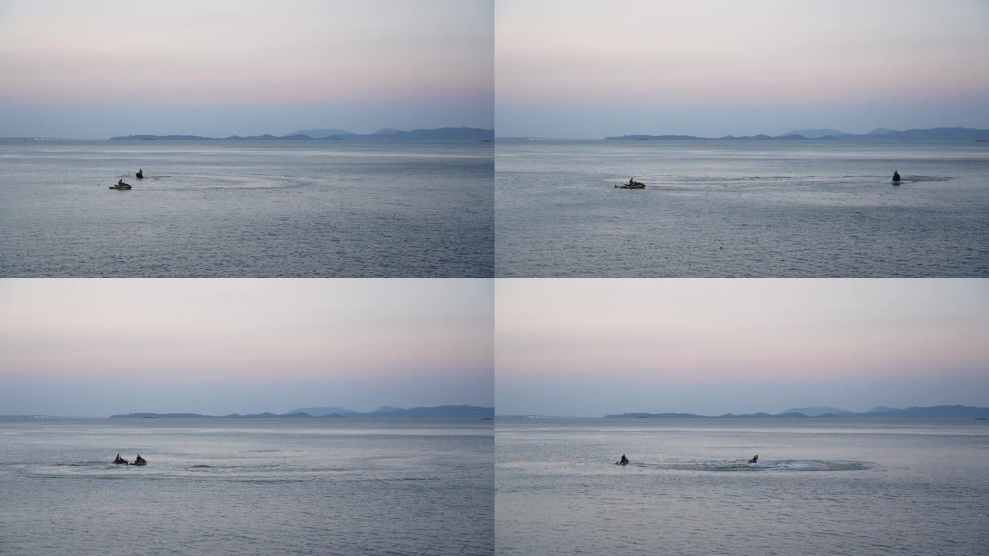 两个男人在海面上骑快艇玩耍