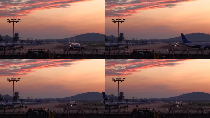 一早清晨朝霞下 机场跑道上准备起飞的飞机