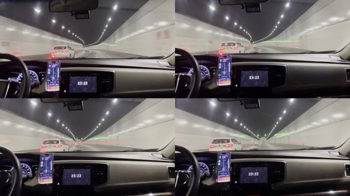 网约车司机按照手机上导航行驶在城市隧道