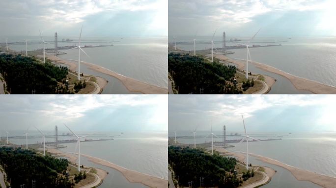 航拍海南省东方市海边石油 风力发电能源