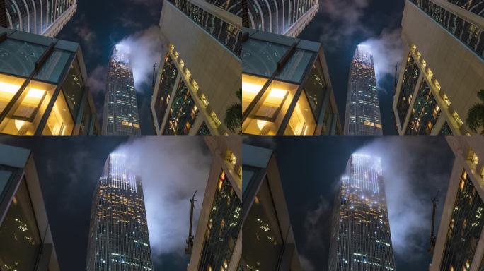 【4K】夜空云层雾气缭绕摩天大楼顶端