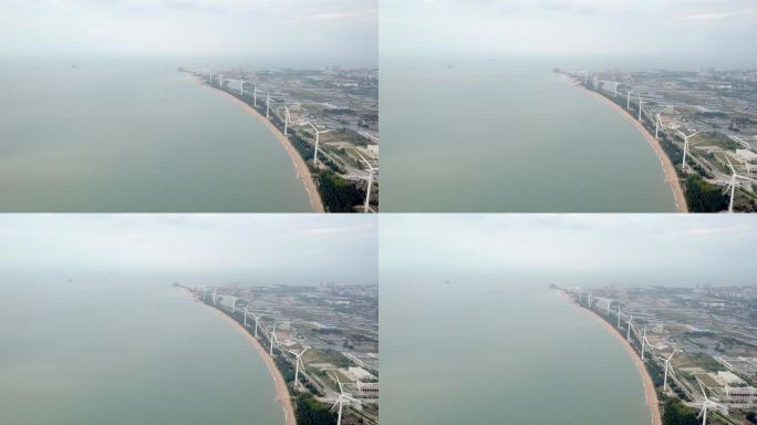 航拍海南省东方市海边石油 风力发电能源