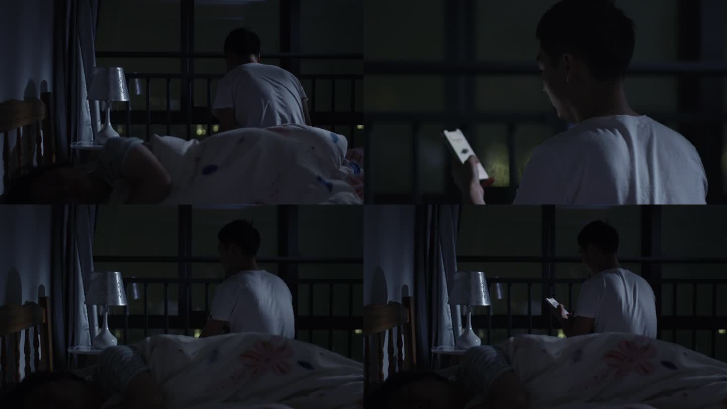 深夜失眠的男人，坐在床边玩手机