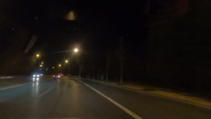 夜景夜晚汽车穿梭在城市道路