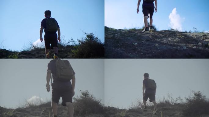 背包的男人徒步-走向山顶背影