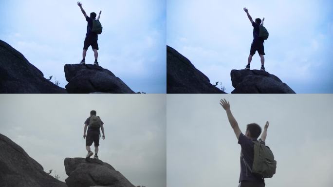 背包的男人爬上山顶拥抱自然-背影升格