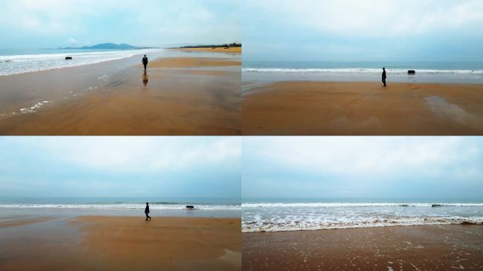 男人在海边悠闲散步大气意向实拍