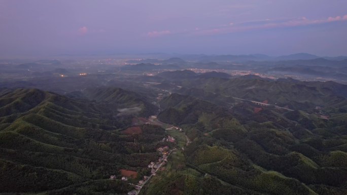 航拍安吉朝霞中的绿水青山山村