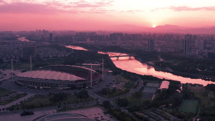 义乌市体育场城市晚霞风光航拍 环绕视角
