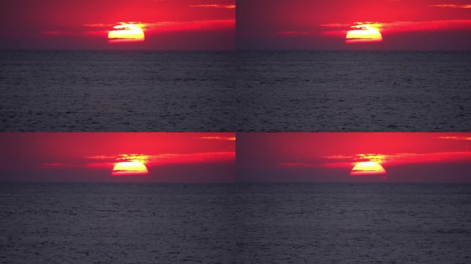 红彤彤的夕阳落在大海水面上