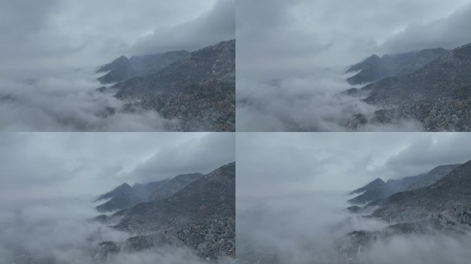 半山腰山脚云雾缭绕阴天小雪航拍白雪覆盖