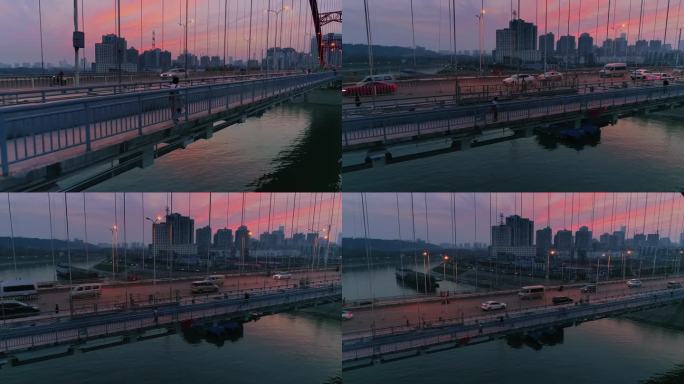 女生独自行走在日落晚霞中的武汉晴川桥航拍