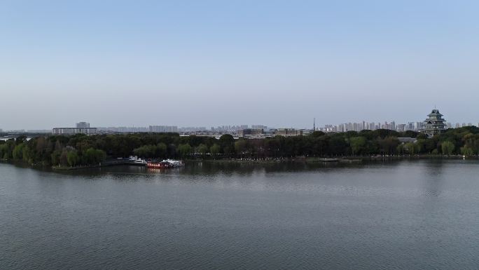 航拍苏州金鸡湖中桃花岛日落晚霞风光