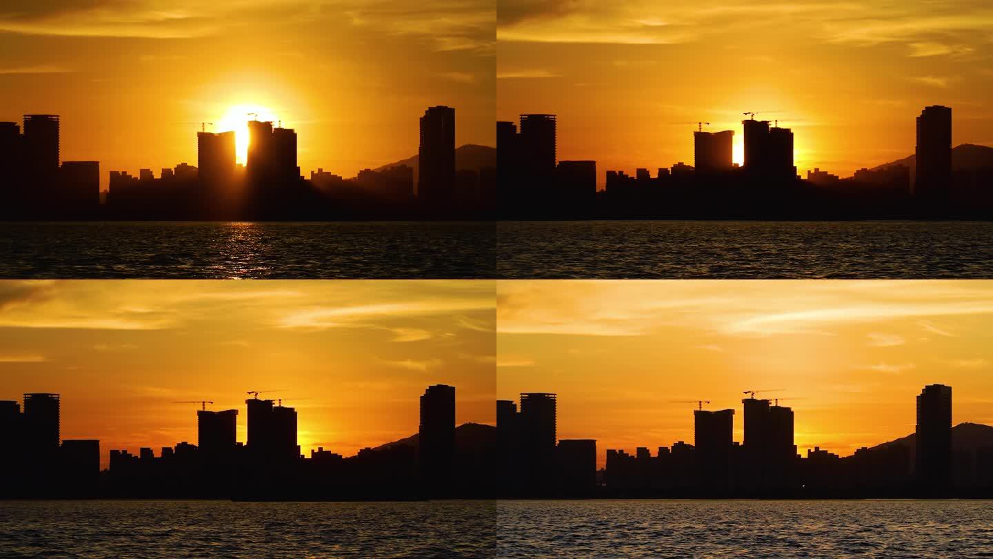 太阳下山城市剪影日落延时摄影