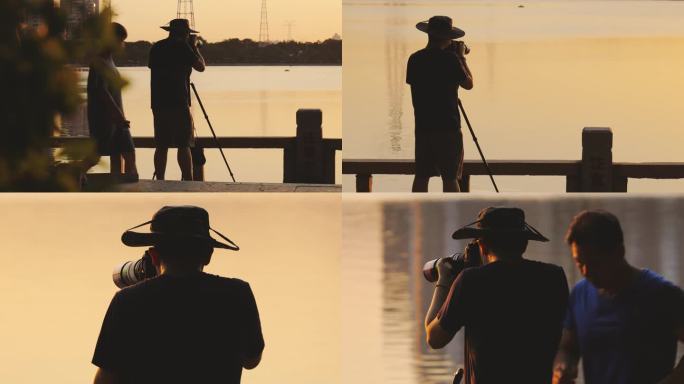 在落日余晖中拍摄的摄影师背影