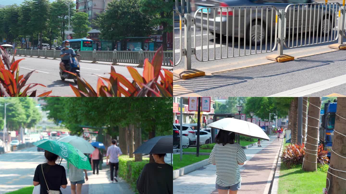 炎热高温街道撑伞的行人