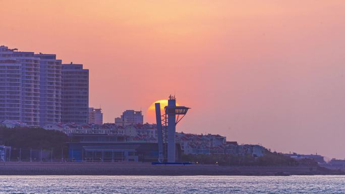 青岛奥帆中心瞭望塔日出太阳从高楼升起