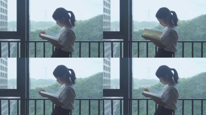 美女窗户边读书享受生活放空自己城市书香