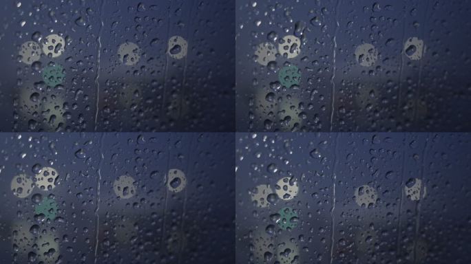 窗户上的雨滴慢慢滑落