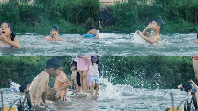 夏天乡村孩子在清澈溪水里戏水嬉闹