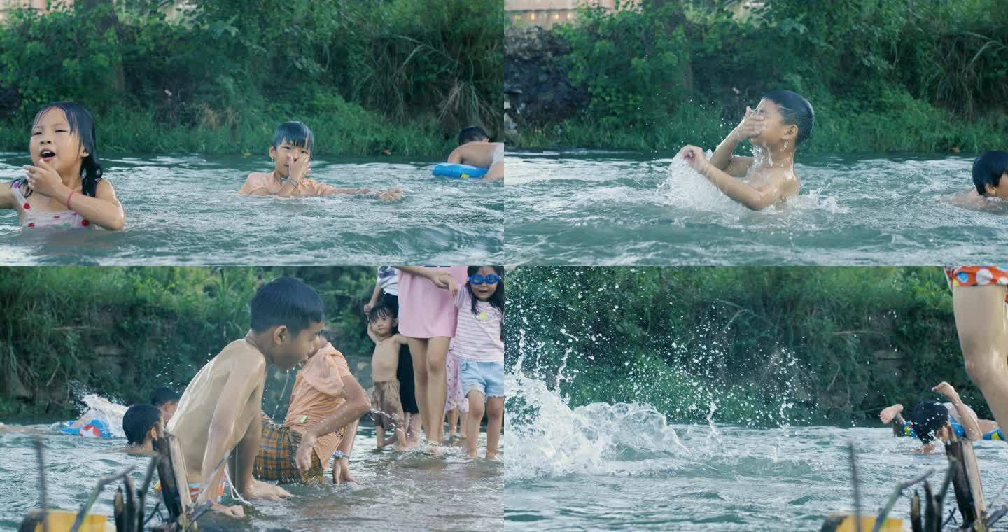 夏天乡村孩子在清澈溪水里戏水嬉闹