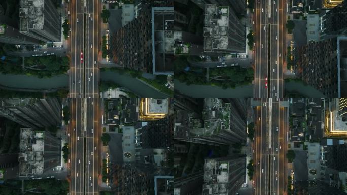 城市交通俯拍现代成都二环路高楼下汽车行驶