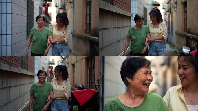 女子带老人走路关爱老人