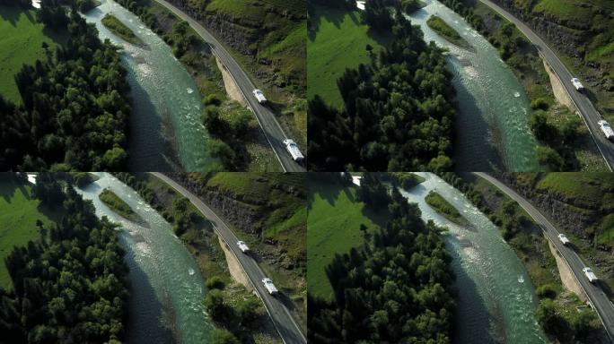 新疆自驾游独库公路航拍小溪边的公路