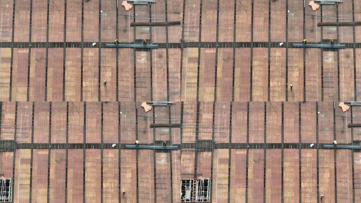 航拍建筑工地屋顶屋面钢筋模板工人施工高温