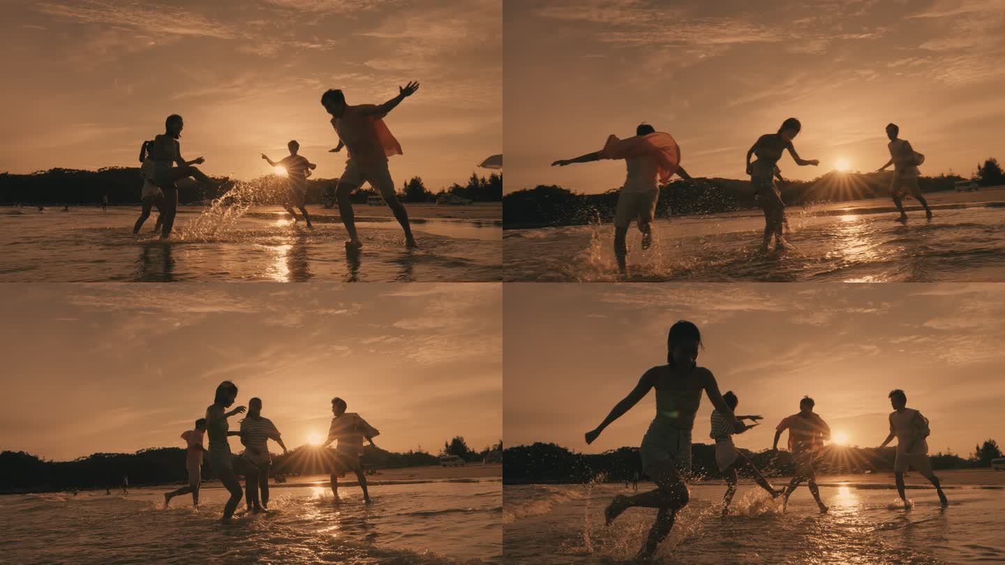 夕阳海边沙滩踢水嬉戏
