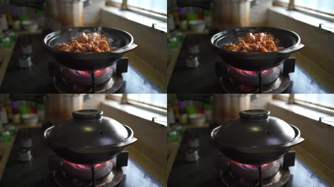 一位厨师在制作美味的啫啫煲沙姜鸡
