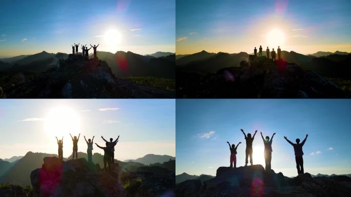 山顶人群拥抱太阳团队登山成功登顶团队协作