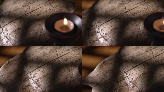 烛光下桌上甲骨文和光与影远古文物文化考古