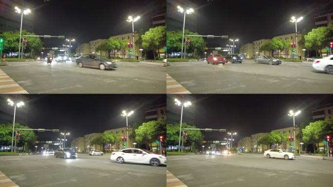 夜晚马路红绿灯路口摩托车汽车通过
