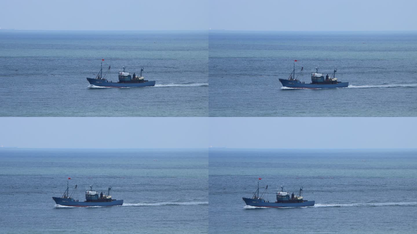 一条渔船驶过海面