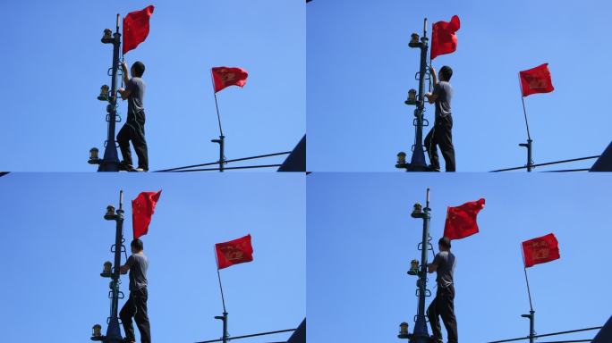 在渔船桅杆上挂红旗的男子
