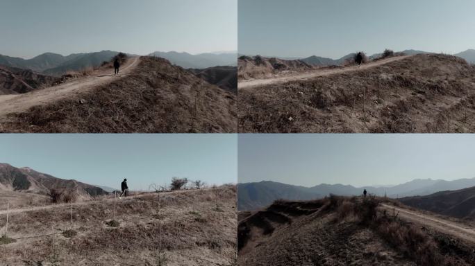 山顶独自行走的男人写意镜头