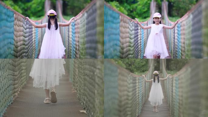 休闲度假-小女孩漫步彩色吊桥亲近自然