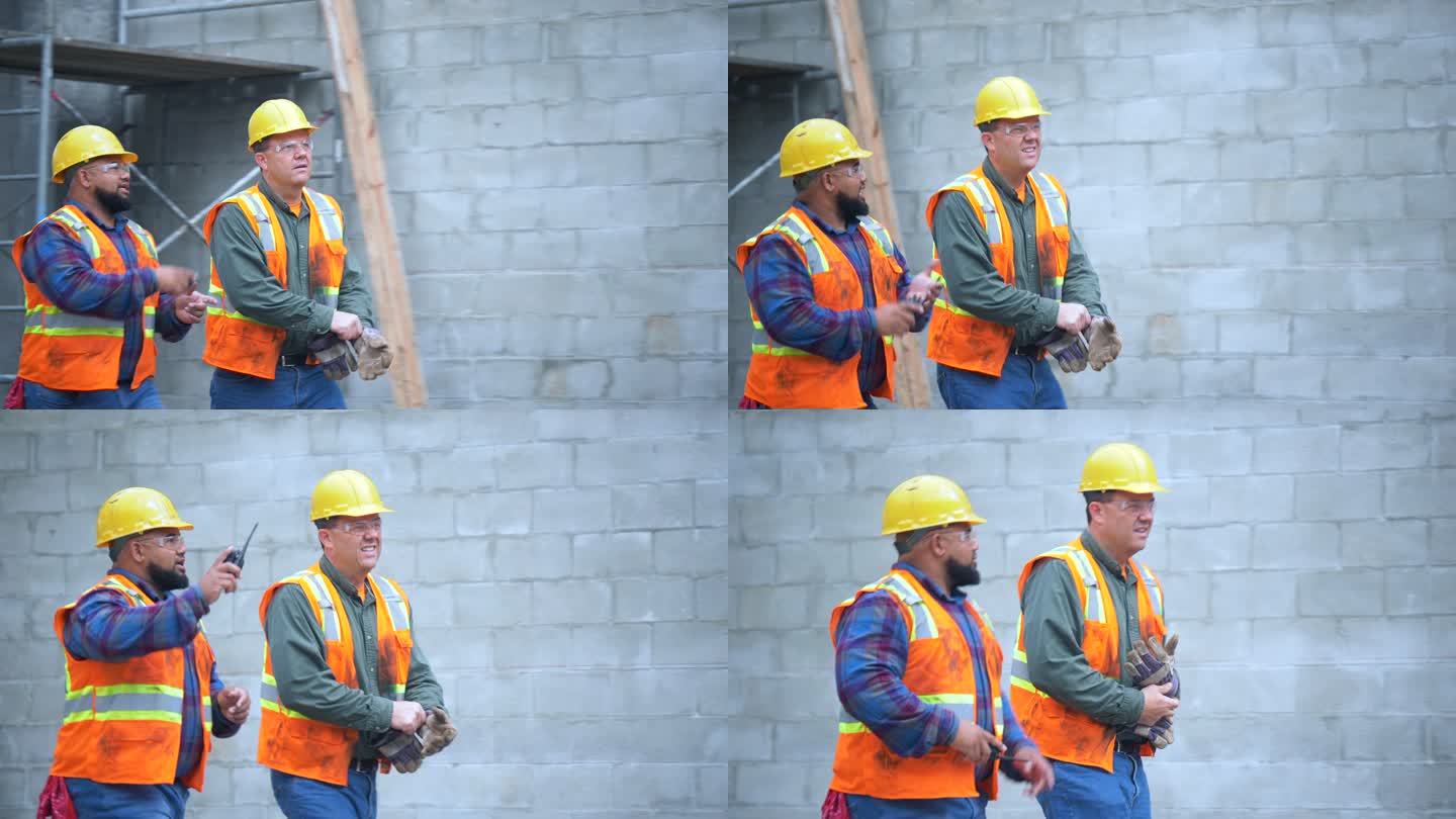 两名建筑工人在工地边走边谈