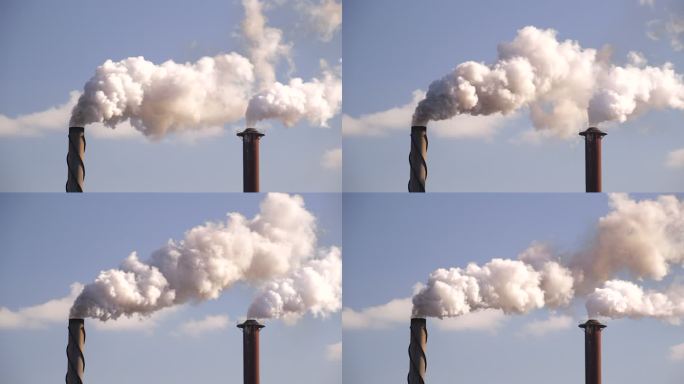 工厂午后阳光下烟囱造成的空气污染。
