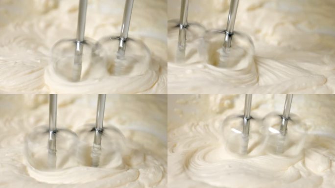 自动面粉混合机搅拌奶油蛋糕，在厨房准备甜点