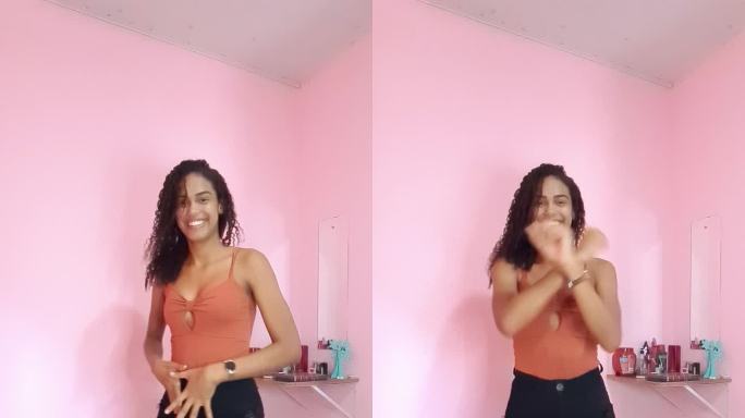一名黑人年轻女子拍摄自己在家跳舞，并在社交媒体上分享