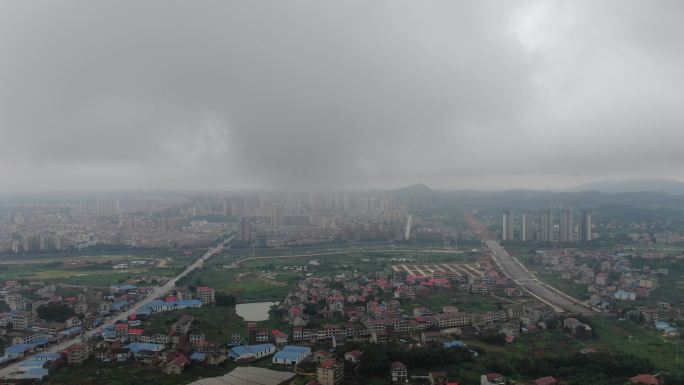 航拍城市暴雨来临雨季