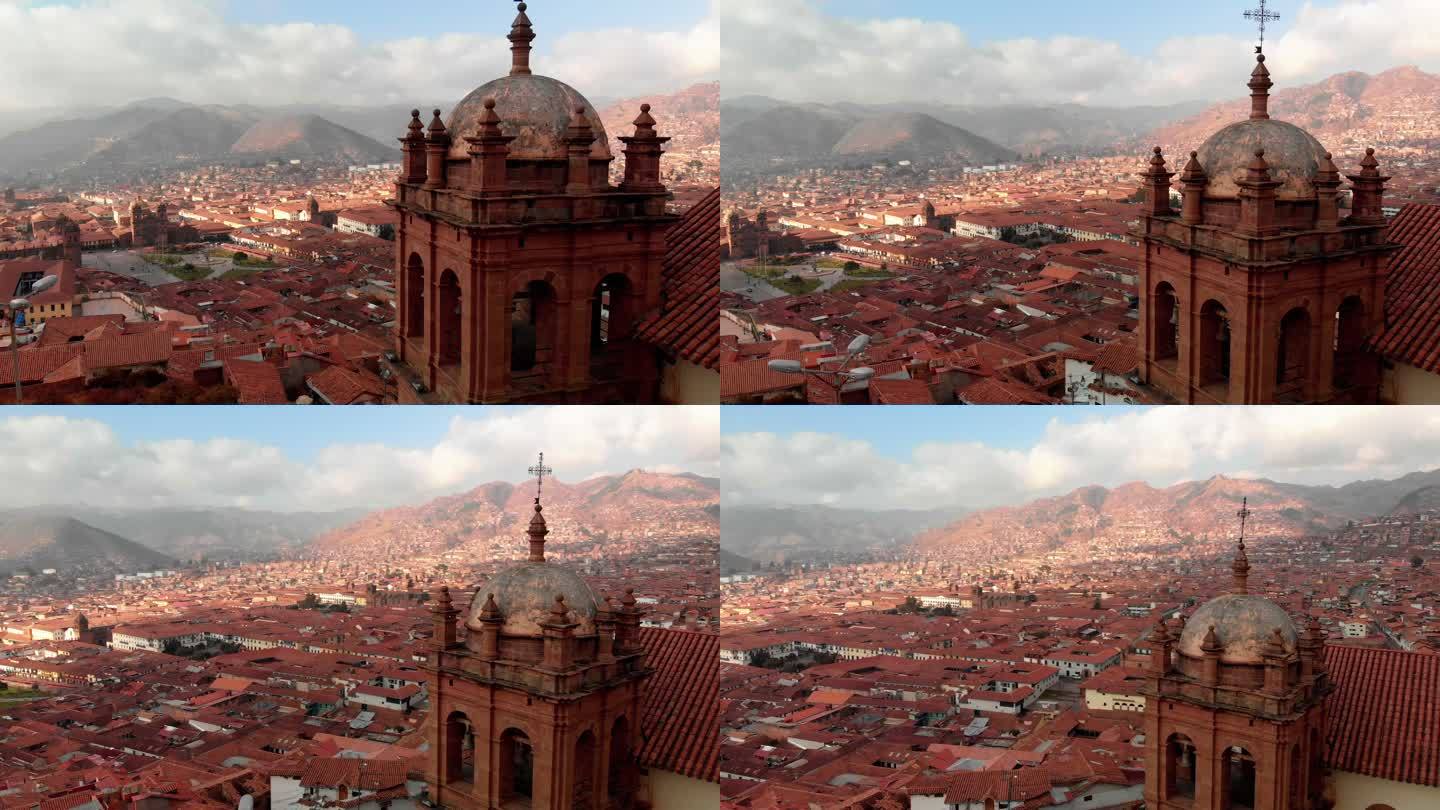 在山上俯瞰南美城市的天主教堂的无人机拍摄