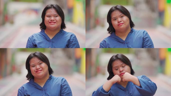 快乐的亚裔马来自闭症唐氏综合症女性在城市街道上看着摄像机微笑