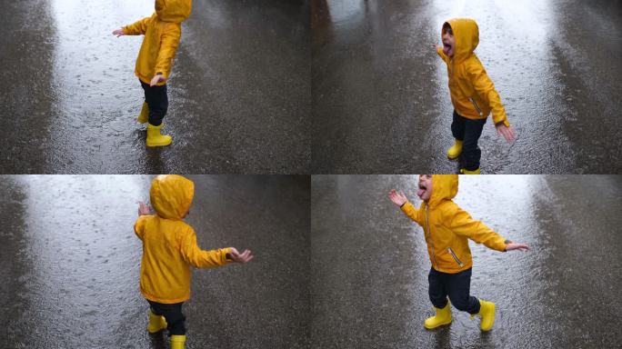 可爱的小男孩在雨天玩耍